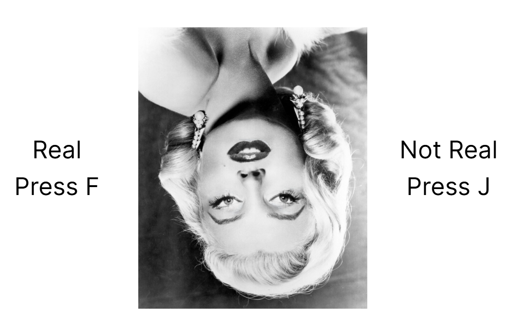 Screenshot of a trial from the Thatcher task, showing an inverted image of a face with the eyes not inverted